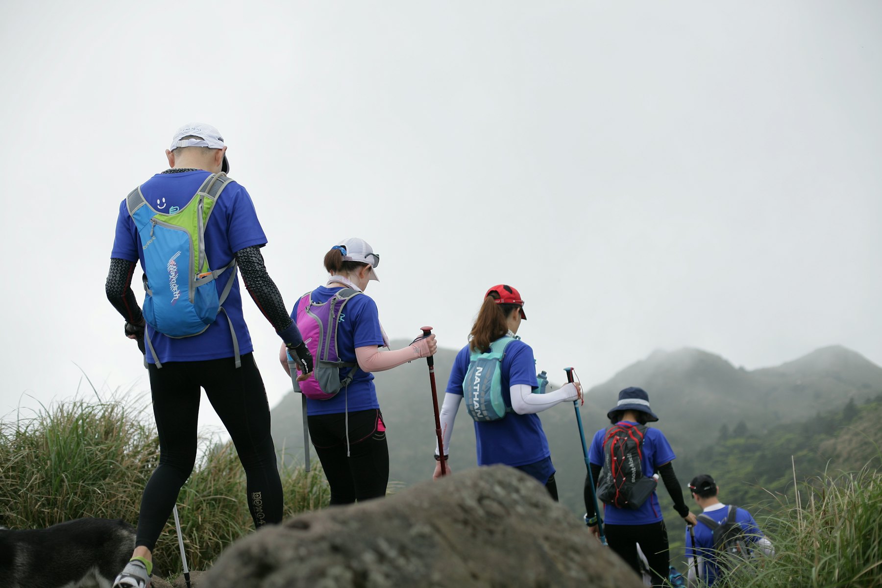 A team hiking a ridge together